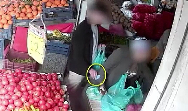 Ürünlerini tartan müşterinin telefonunu çaldı